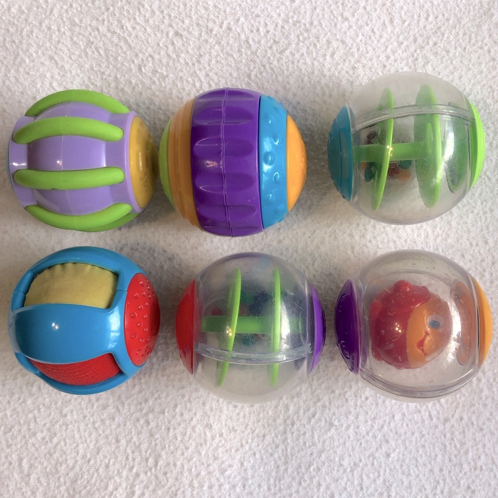 2 Fisher Price Roll-a-Rounds and 4 Bright Starts Activity Balls.